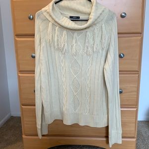Cream oversized turtleneck with fringe